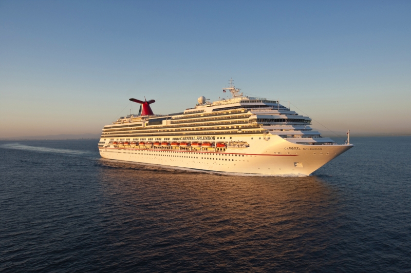 Travel X A large white cruise ship sails on the open sea during sunset, with multiple decks and a red and blue funnel. Book your trip now for an unforgettable vacation aboard this floating resort. Book Your Trip With Travel X