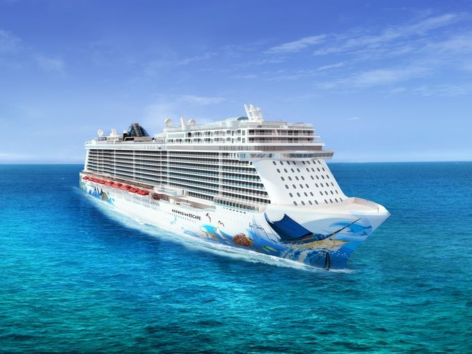 Travel X A large white cruise ship sails on clear blue waters under a bright sky. The ship, resembling a floating resort, has multiple decks and colorful artwork on the hull. Book your trip now for an unforgettable vacation experience. Book Your Trip With Travel X