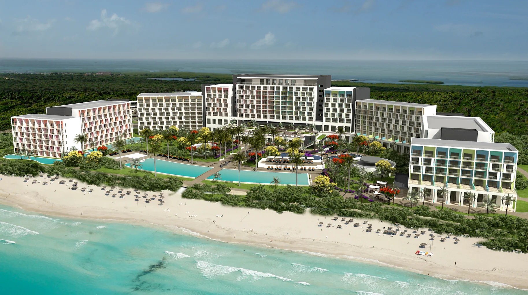 Travel X Aerial view of Travel X's large, modern beachfront resort with multiple buildings, swimming pools, and landscaped areas set against a backdrop of trees and facing a sandy beach with turquoise water. Book your trip today! Book Your Trip With Travel X